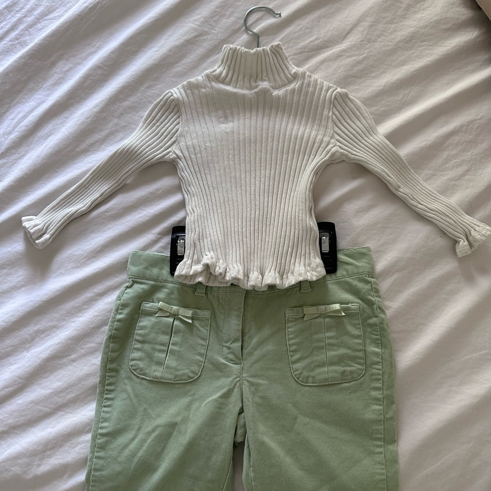 Turtle neck white shirt with ribbed green pants